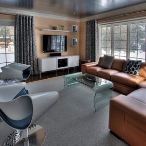 Contemporary living room with sectional, accent chairs, and coffee table