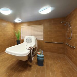 a bath tub in a wet room with wood tile
